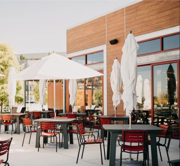 Modern patio with outdoor seating and sun umbrellas