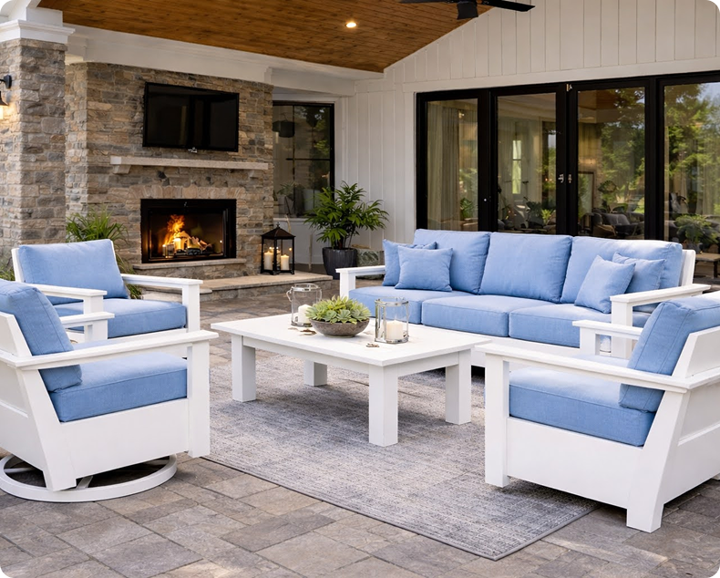 Red Adirondack chairs on a wooden deck overlooking the water